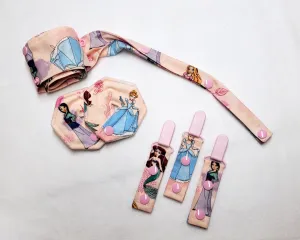 Set of Princess feeding tube accessories - 44" cord keeper, 3 clips, and 2 button cushions